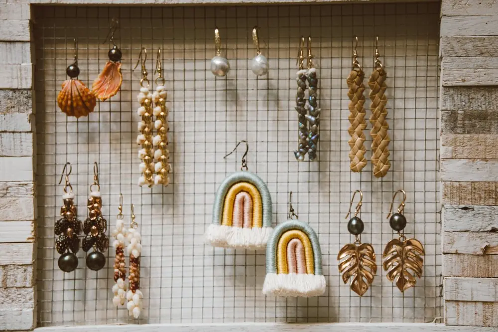 A frame of assorted handmade earrings